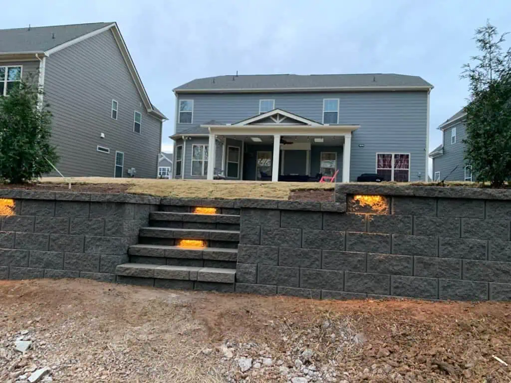 Brightly Lit Stone Retaining Wall with Steps.