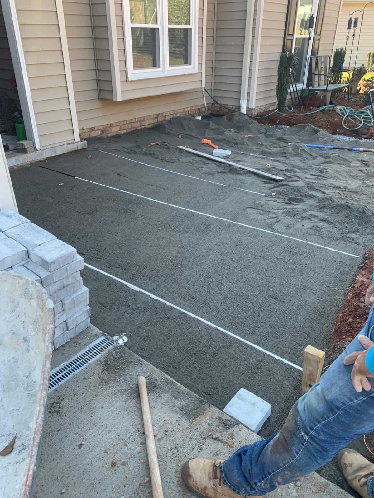 Backyard concrete patio installation.